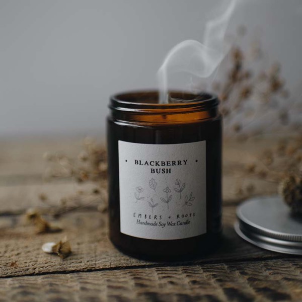 Blackberry Bush soy candle on a weathered wooden surface