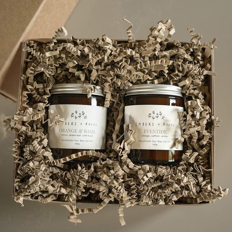 An Embers & Roots duo candle gift set, two soy candles in a kraft gift box